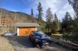 Nestled in a serene mountain setting, this property offers a perfect blend of nature and comfort.