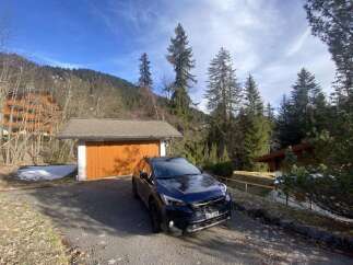 Nestled in a serene mountain setting, this property offers a perfect blend of nature and comfort.