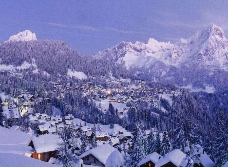 Nestled in a picturesque winter wonderland, this property offers stunning views of snow-capped mountains and a charming village.
