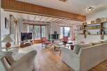 Experience the charm of this inviting living space, featuring a cozy fireplace and stunning mountain views.