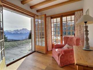 Experience breathtaking mountain views from this charming property.