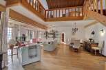 Step into luxury with this stunning property featuring a spacious living area with a cozy fireplace.
