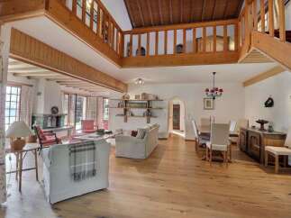 Step into luxury with this stunning property featuring a spacious living area with a cozy fireplace.