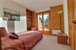 Discover a cozy bedroom retreat with stunning mountain views.