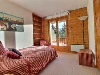 Discover a cozy bedroom retreat with stunning mountain views.