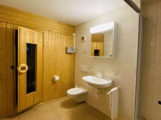 Discover the perfect blend of relaxation and convenience in this stunning bathroom.