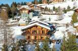 Discover the epitome of luxury living in this stunning chalet nestled amidst a picturesque snow-covered landscape.