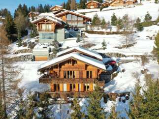 Discover the epitome of luxury living in this stunning chalet nestled amidst a picturesque snow-covered landscape.