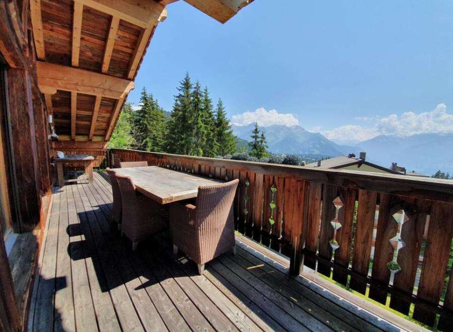 Enjoy breathtaking mountain views from this stunning outdoor deck.