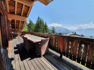 Enjoy breathtaking mountain views from this stunning outdoor deck.