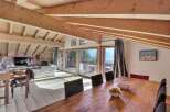 Experience luxury living in this stunning property featuring a spacious living area with a cozy fireplace and a modern TV.