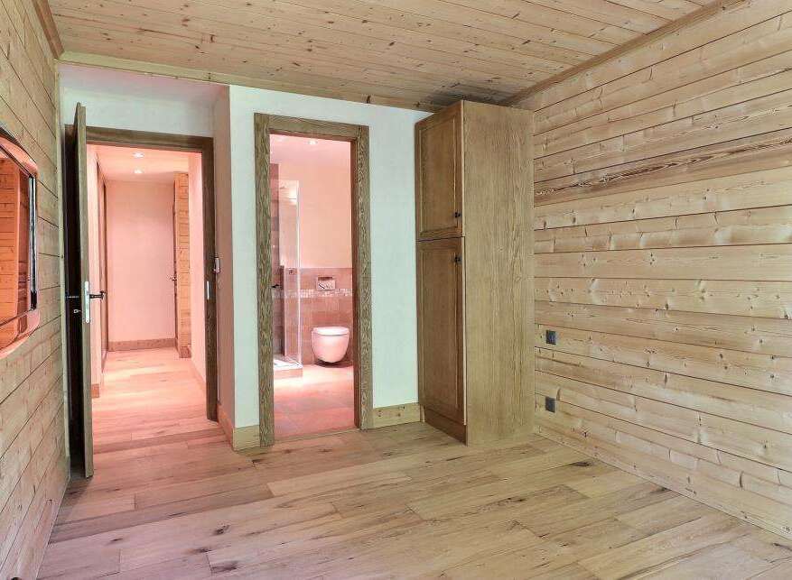 Step into this inviting space, showcasing a harmonious blend of natural wood elements.