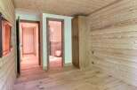 Step into this inviting space, showcasing a harmonious blend of natural wood elements.