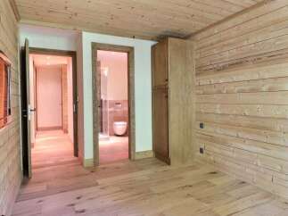 Step into this inviting space, showcasing a harmonious blend of natural wood elements.