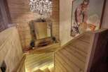 This stunning property features a beautifully crafted wooden staircase, exuding warmth and elegance.