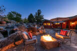 Experience the ultimate outdoor oasis with this stunning property! Featuring a cozy fire pit, perfect for evening gatherings, and a serene waterfall feature, this home offers a blend of relaxation and entertainment.