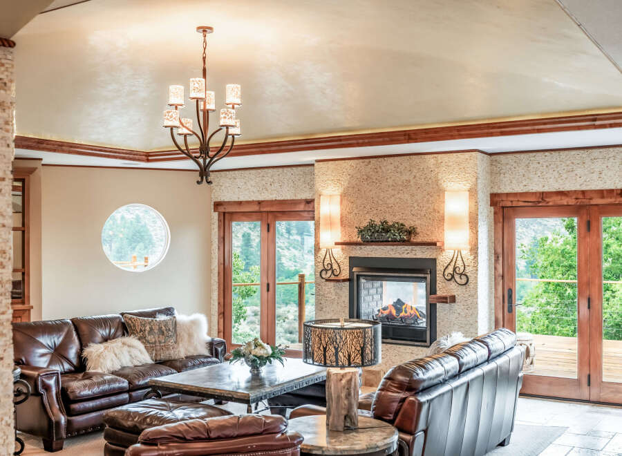 This luxurious living room boasts a cozy fireplace, perfect for chilly evenings.