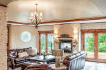 This luxurious living room boasts a cozy fireplace, perfect for chilly evenings.