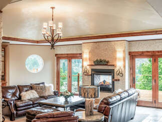 This luxurious living room boasts a cozy fireplace, perfect for chilly evenings.