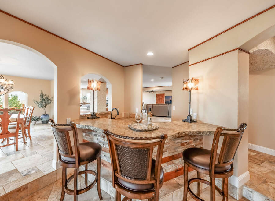 This stunning property boasts a beautifully designed bar area, perfect for entertaining guests.