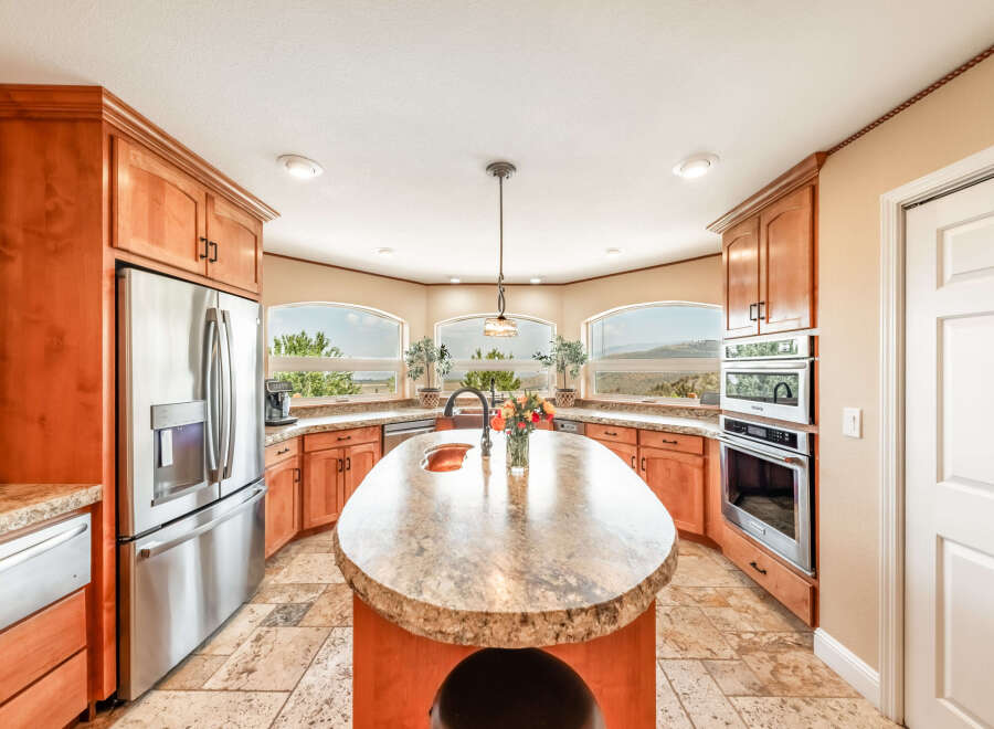 Step into this stunning kitchen, the heart of the home, featuring a spacious island perfect for meal prep and gatherings.