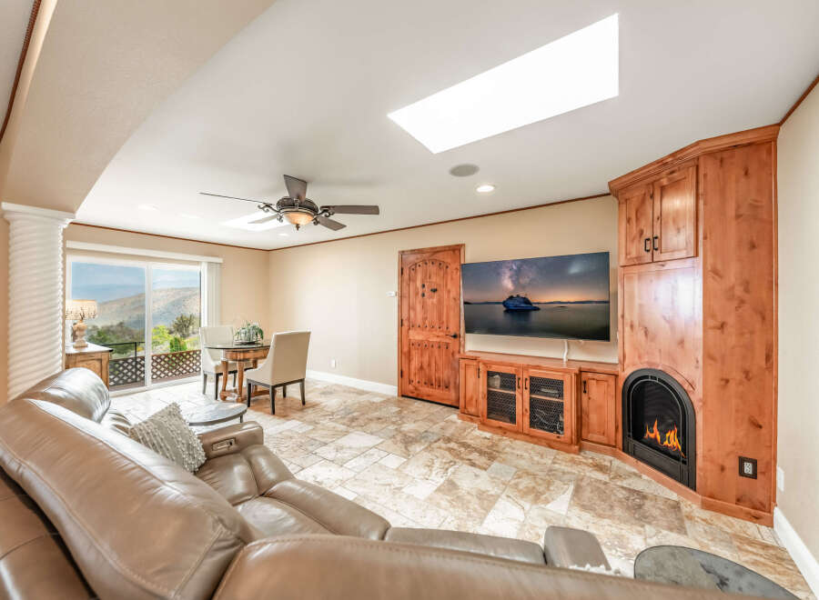 This stunning living space features a cozy fireplace, perfect for relaxing evenings.