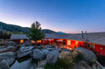 Experience luxury living in this stunning property featuring a beautiful red exterior and a serene outdoor oasis.