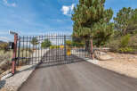 Discover the charm of this gated property, featuring a secure entrance and a welcoming driveway.