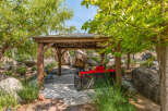Enjoy the tranquility of this outdoor oasis, featuring a charming gazebo with comfortable seating.