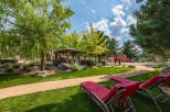 Enjoy the tranquility of this stunning property featuring lush green lawns and a charming gazebo, perfect for outdoor relaxation.