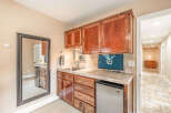 This stunning property boasts a beautifully designed wet bar, perfect for entertaining guests.