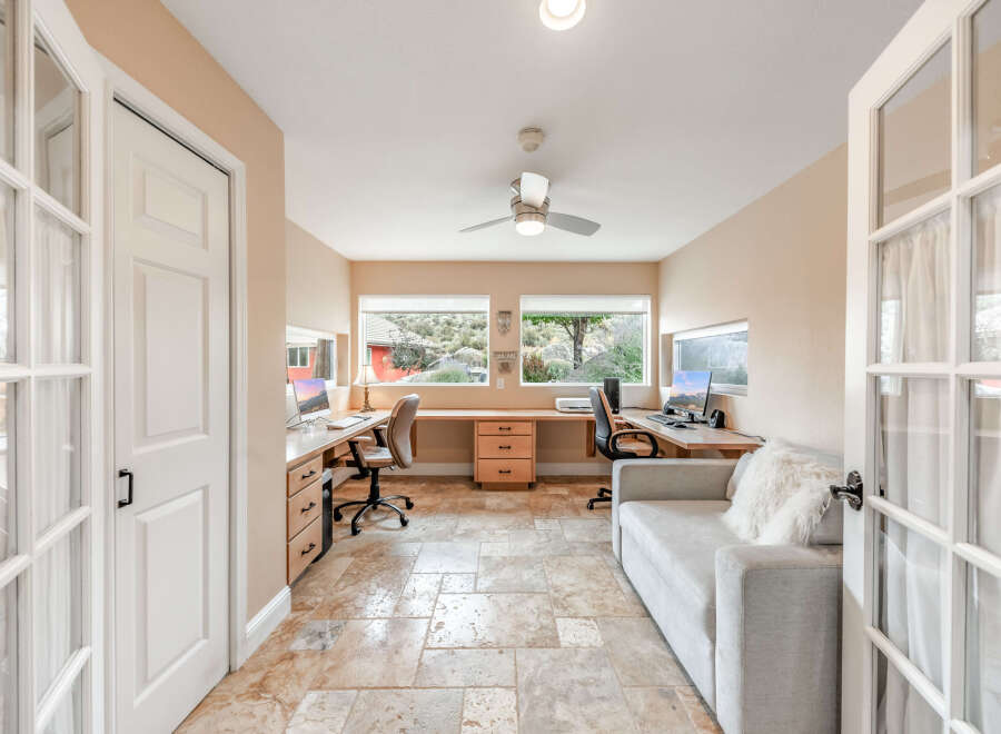 Discover the perfect blend of comfort and functionality in this stunning home office.