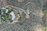 This stunning property boasts a unique architectural design, seamlessly blending with its natural surroundings.