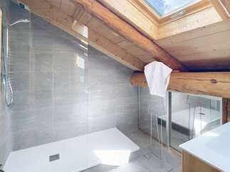 Experience luxury in this stunning bathroom featuring a modern shower and elegant design.