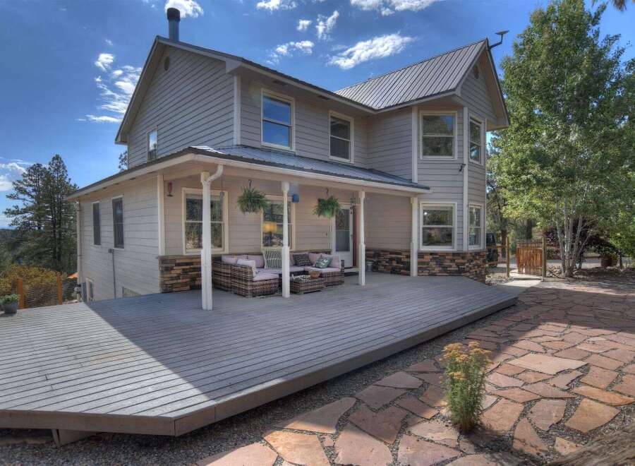 Discover your dream home! This stunning property boasts a spacious deck perfect for entertaining and enjoying the scenic views.