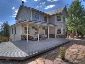 Discover your dream home! This stunning property boasts a spacious deck perfect for entertaining and enjoying the scenic views.