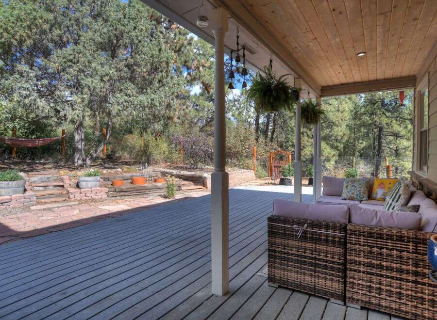 Enjoy the tranquility of this beautiful outdoor space! This property features a spacious deck, perfect for entertaining or relaxing.