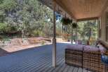 Enjoy the tranquility of this beautiful outdoor space! This property features a spacious deck, perfect for entertaining or relaxing.
