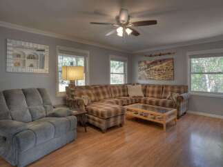 Step into this inviting living space, perfect for relaxation and entertaining.