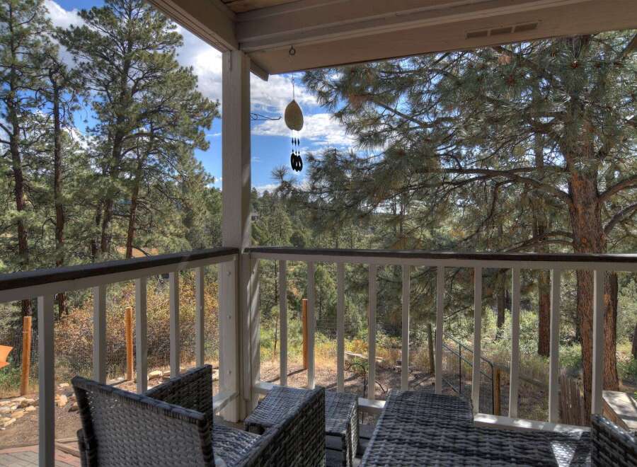 Enjoy the tranquility of nature from this charming porch.
