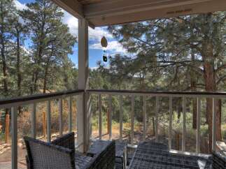Enjoy the tranquility of nature from this charming porch.