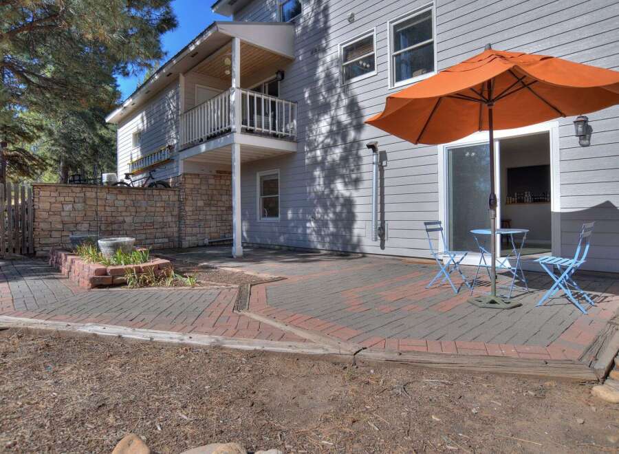 Enjoy outdoor living at its finest with this stunning property! The backyard features a charming brick patio, perfect for entertaining or relaxing.