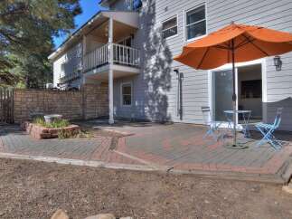 Enjoy outdoor living at its finest with this stunning property! The backyard features a charming brick patio, perfect for entertaining or relaxing.