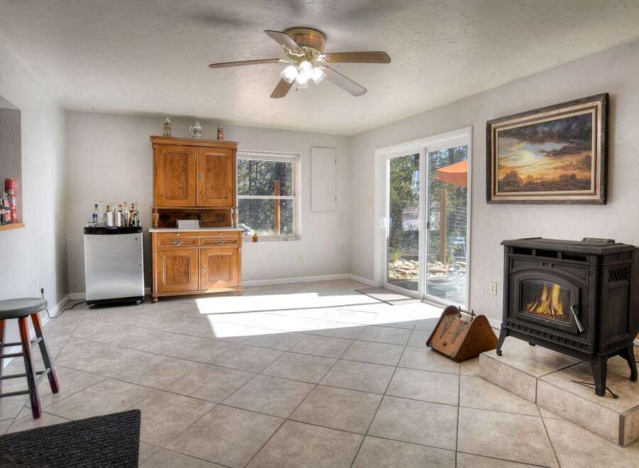 Step into this inviting living space, featuring a cozy fireplace and ample natural light.