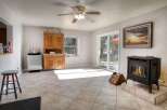 Step into this inviting living space, featuring a cozy fireplace and ample natural light.