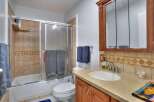 Step into this inviting bathroom featuring a combination of functionality and style.