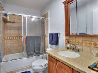 Step into this inviting bathroom featuring a combination of functionality and style.