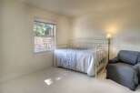 This charming bedroom features a cozy daybed, perfect for relaxing or accommodating guests.