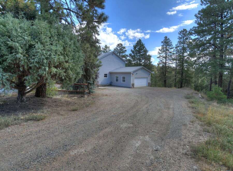 Nestled in a serene, wooded setting, this property offers a tranquil escape.