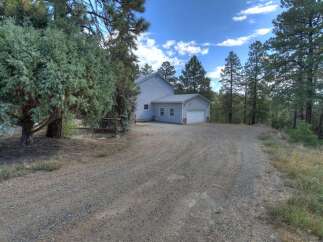 Nestled in a serene, wooded setting, this property offers a tranquil escape.